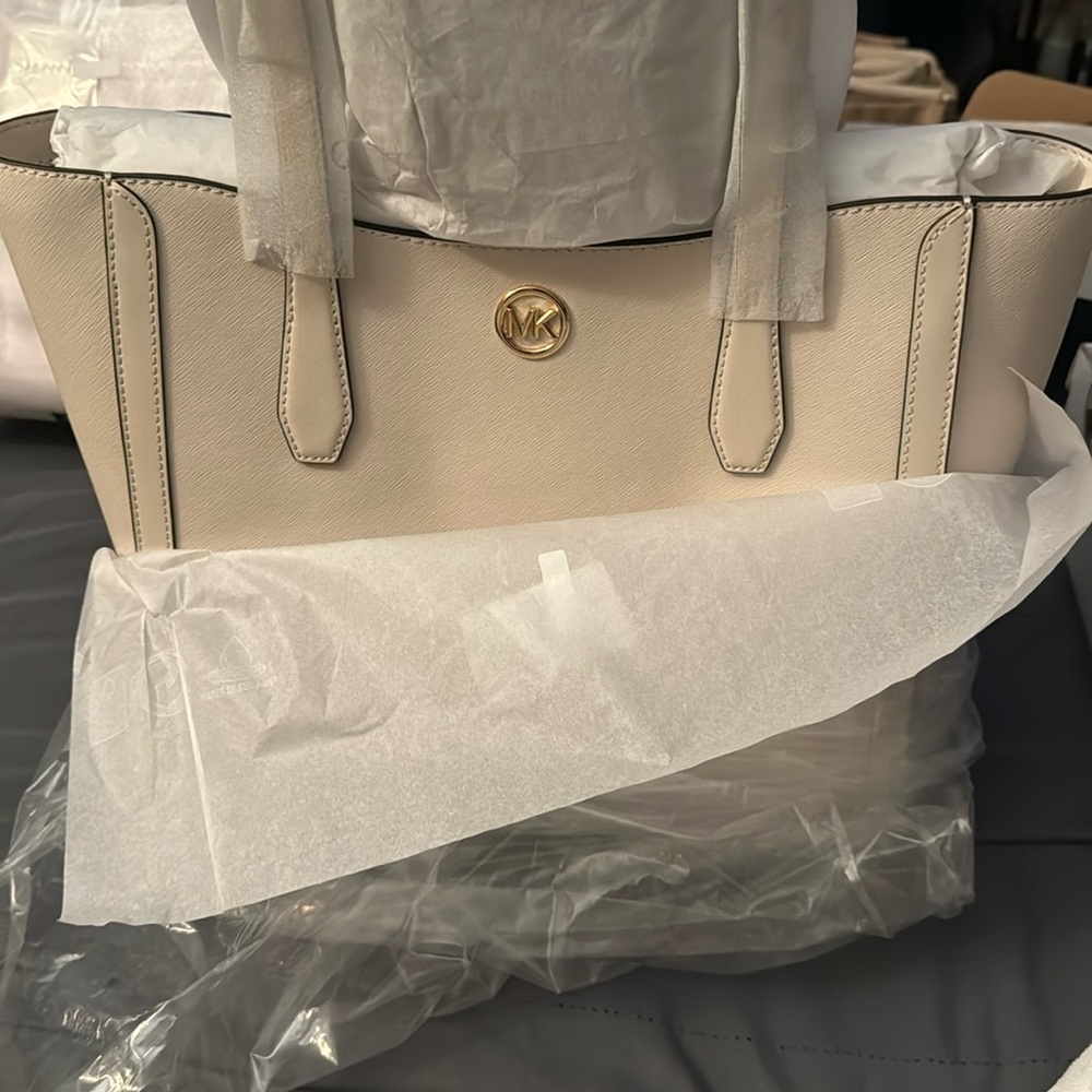 MK -NWT, plastic and dust bag. Light Cream color.